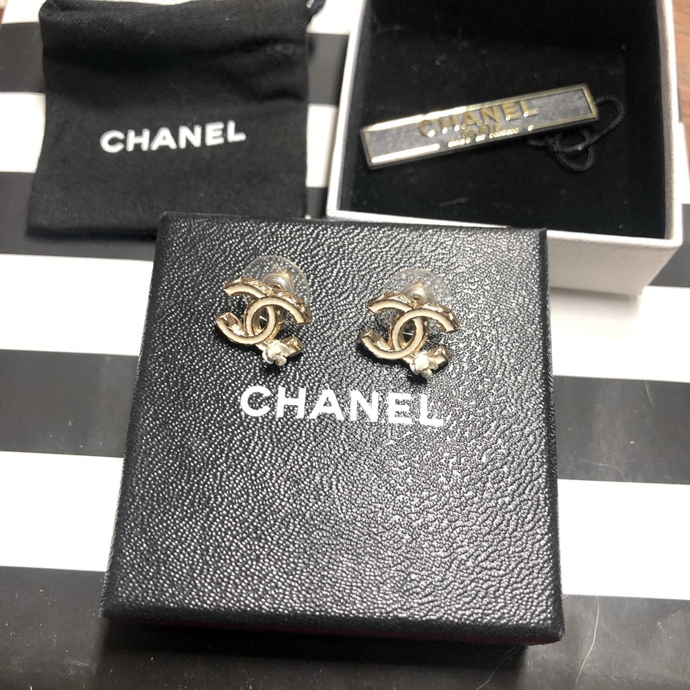 SOLD-Authentic Chanel white CC logo earrings with camellia flower